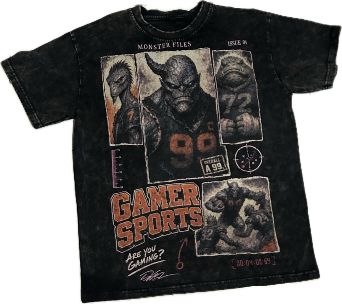 A black acid-wash graphic t-shirt featuring artwork from the video game franchise Monster Hunter, including a large central illustration of a horned monster, smaller character panels, and 'GAMER SPORTS' text on a white background.